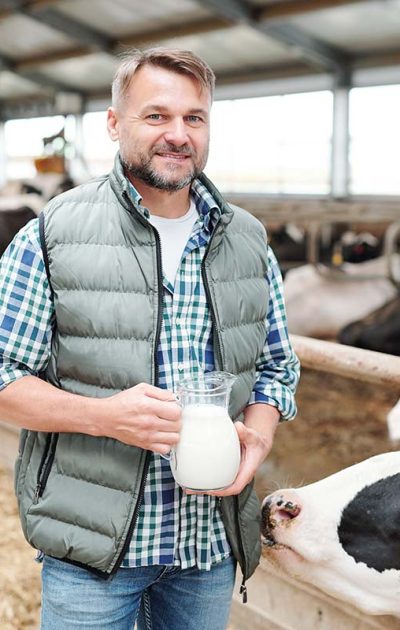 happy-young-worker-of-dairy-farm-holding-jug-with-resize happy-young-worker-of-dairy-farm-holding-jug-with-resize
